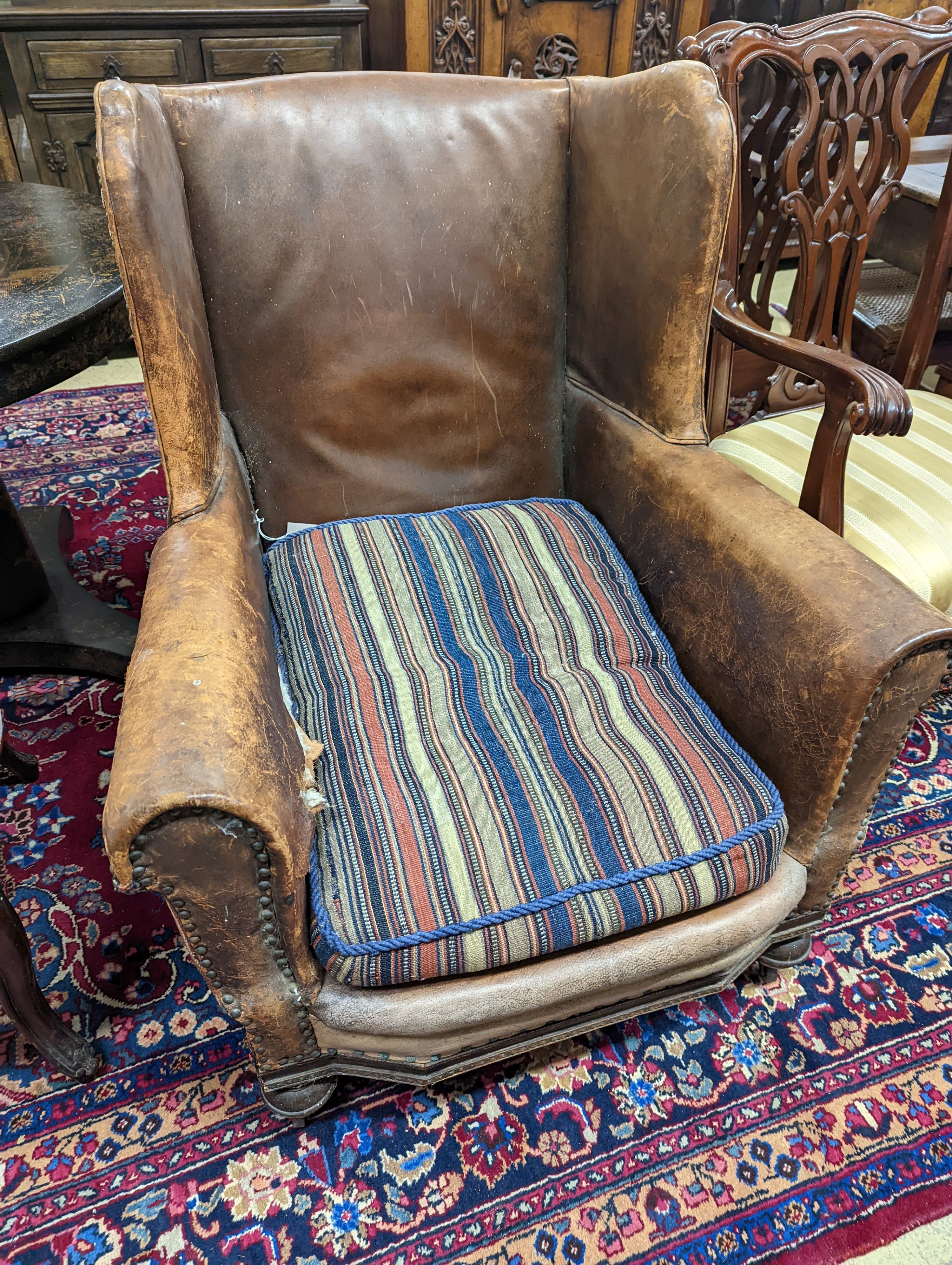 A 1940s French leather club armchair. H-91cm.